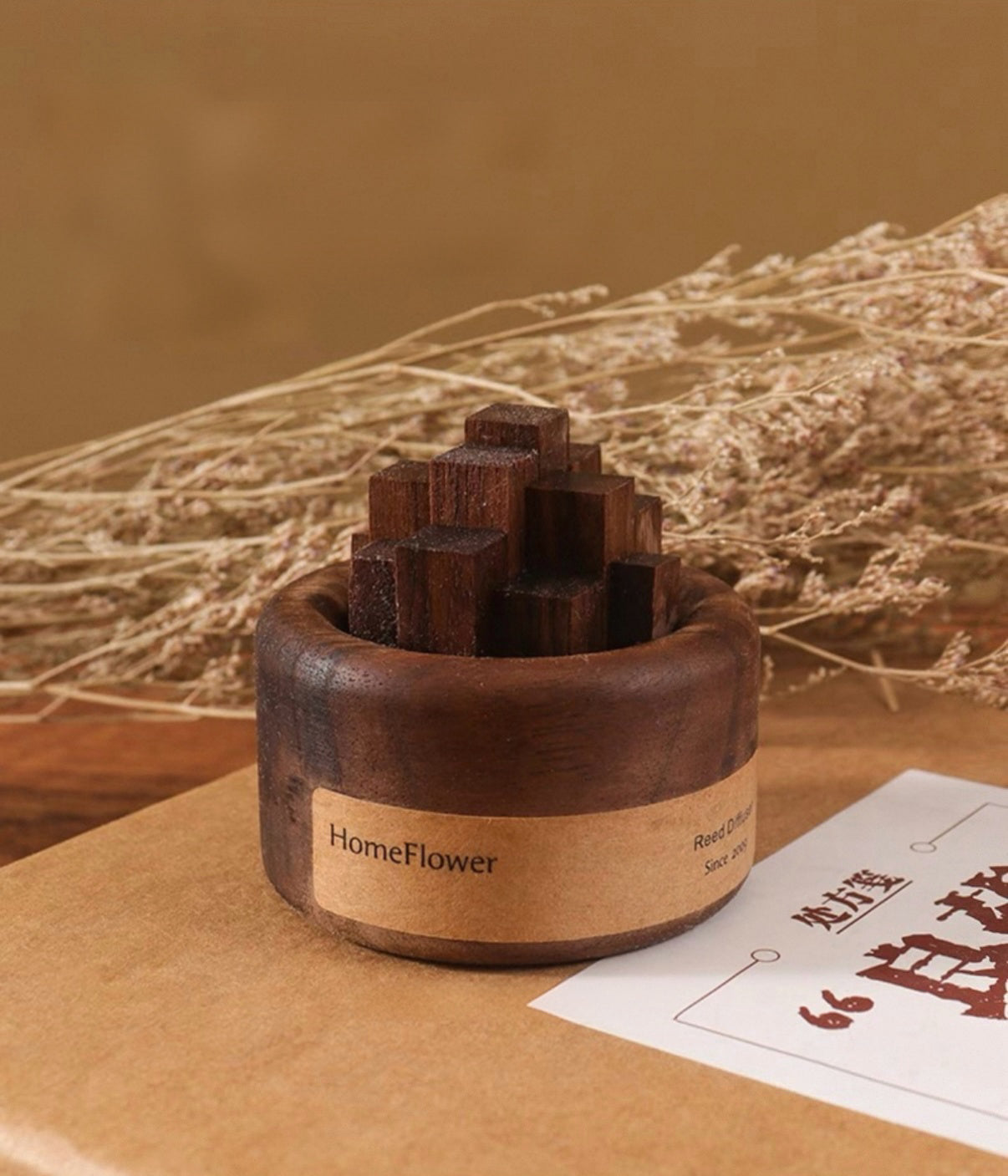 Wooden incense holder with 'HomeFlower' branding on a brown surface with dried plants in the background.