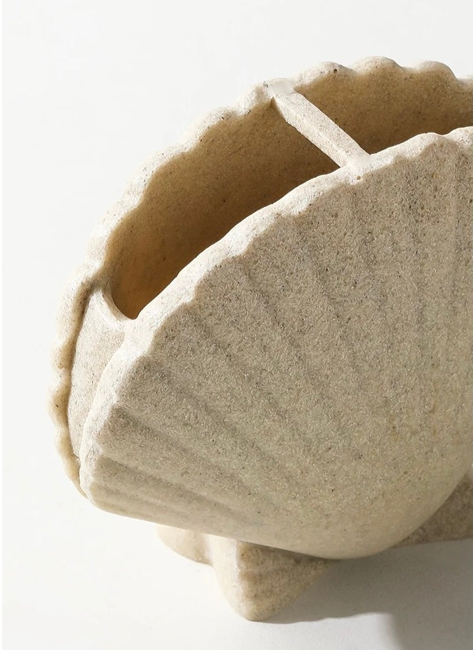 Beige stone bowl on a white background