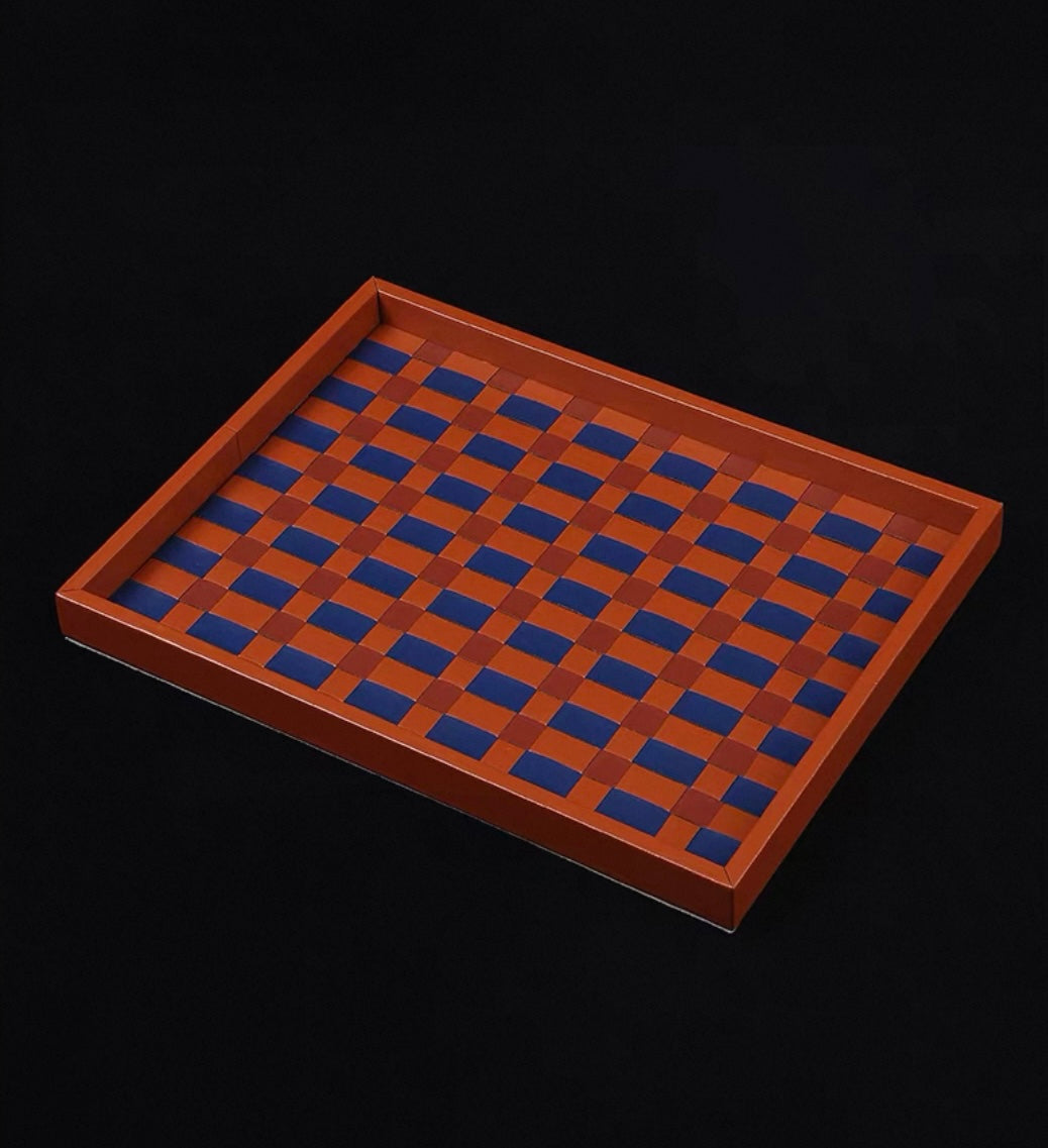 Wooden tray with blue checkered pattern on a black background