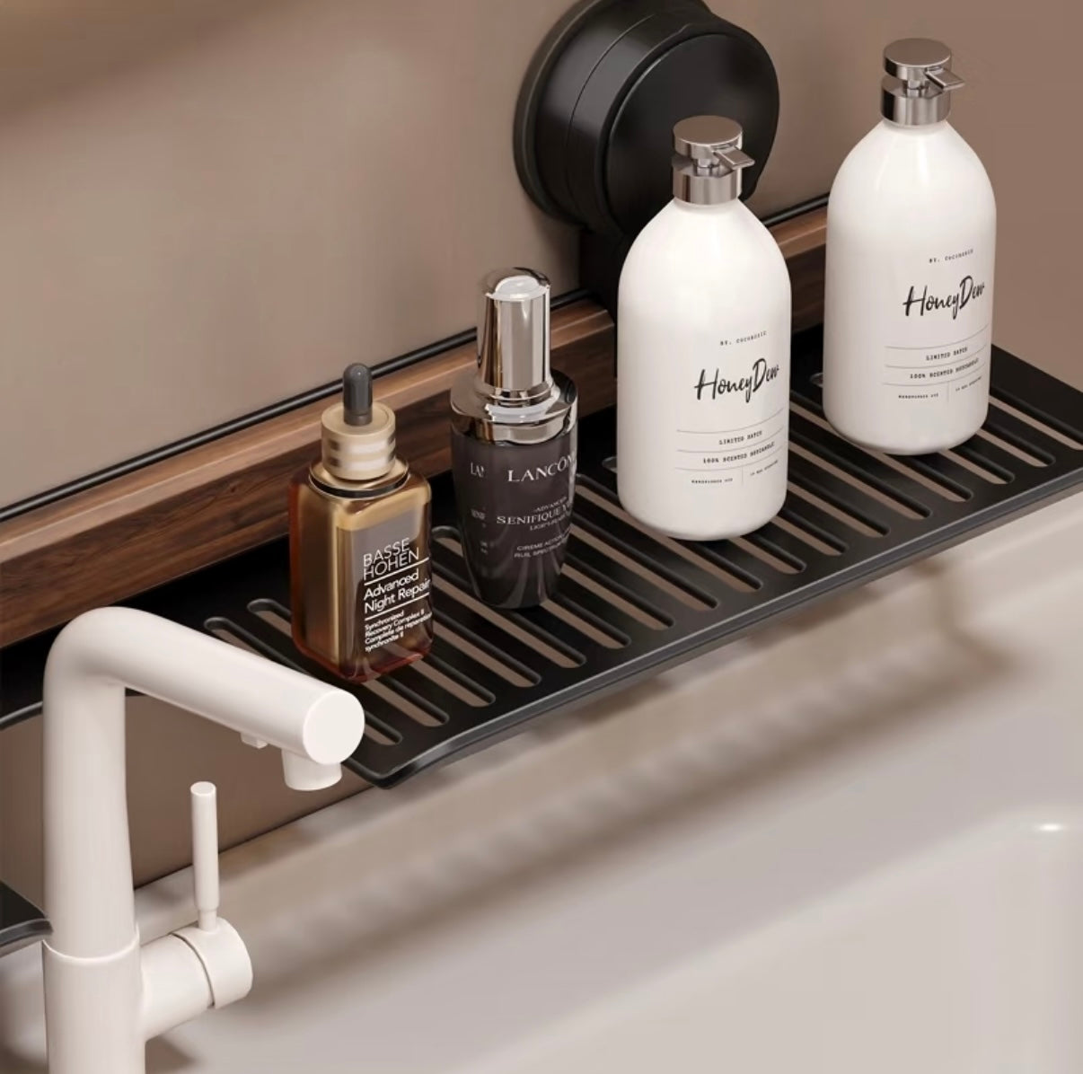 Bathroom shelf with skincare products and a white faucet.