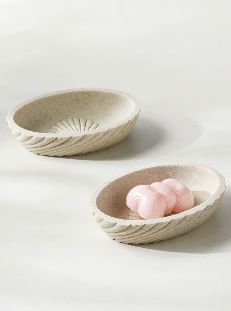 Two ceramic bowls on a light gray background