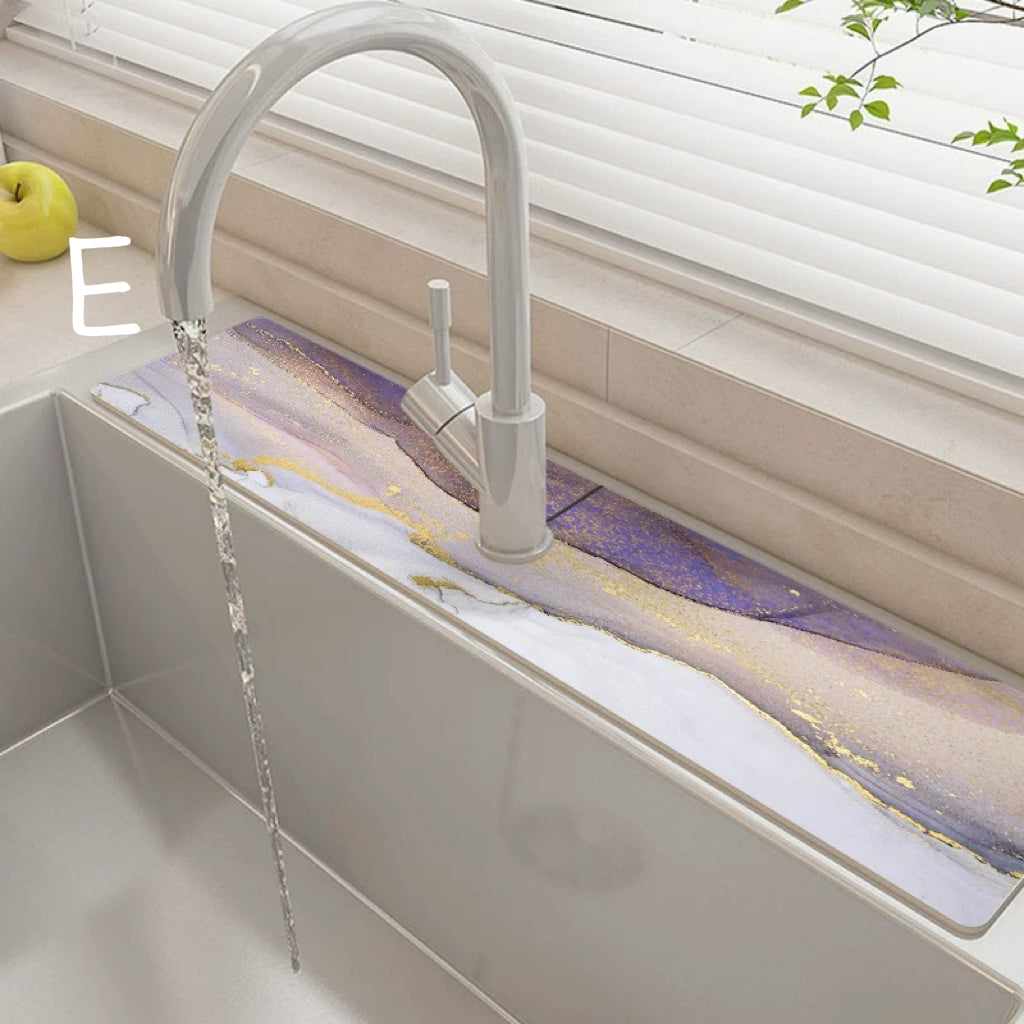 Modern kitchen sink with a faucet and water flowing, featuring a colorful purple abstract design.