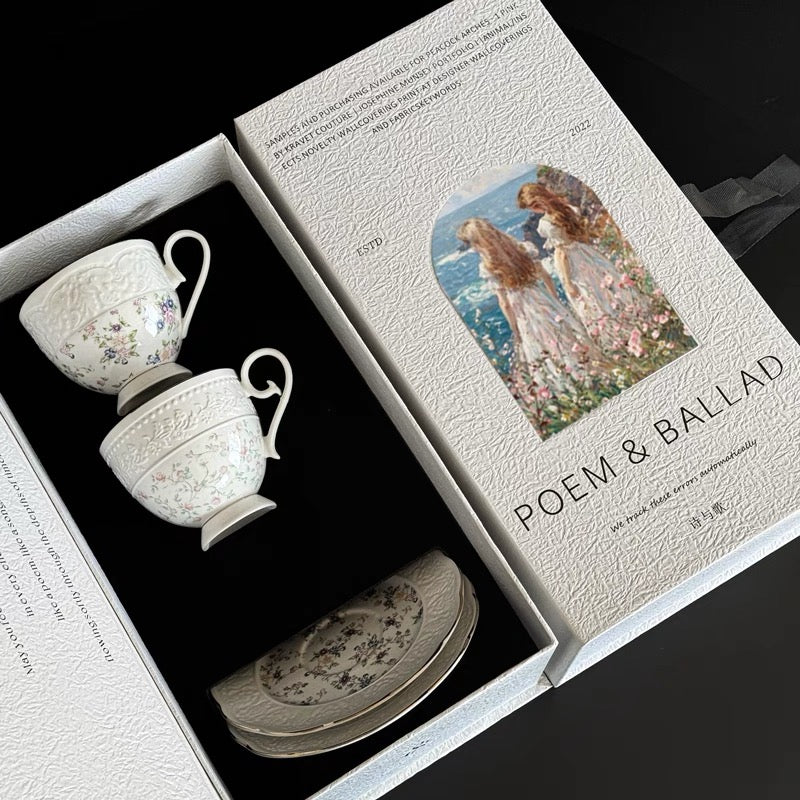 Ceramic tea set with 'Poem & Ballad' packaging featuring an illustration of a couple.