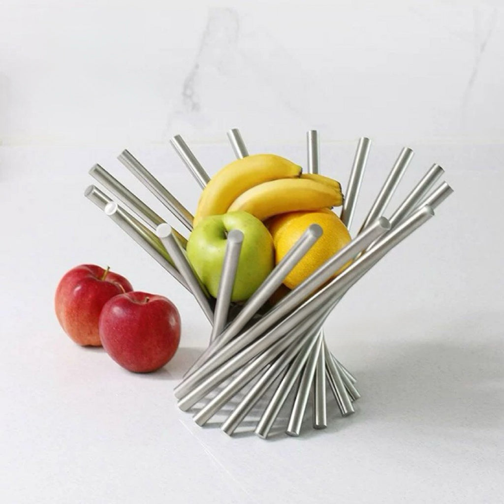 Metallic fruit bowl with apples and bananas on a white background