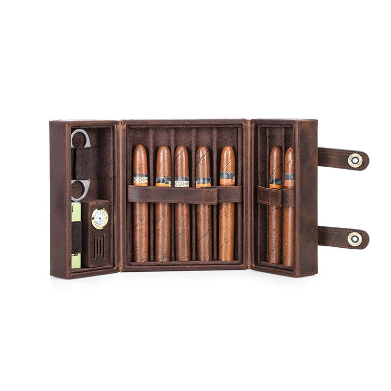 Set of cigars with a humidor and cutter on a white background