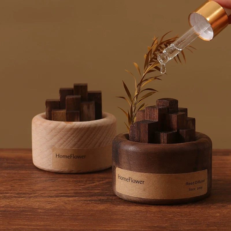Wooden diffusers with 'HomeFlower' branding on a wooden surface.