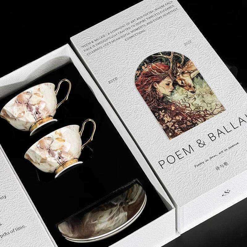 Marble-patterned tea set in a 'Poem & Ballad' box with artistic design.