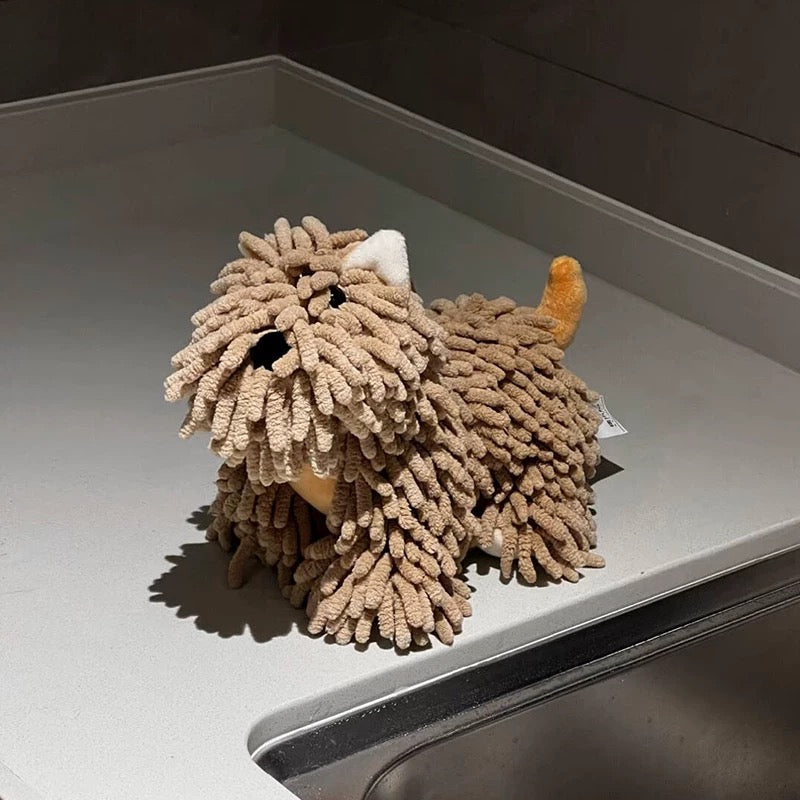 Textured lion-shaped object on a gray surface