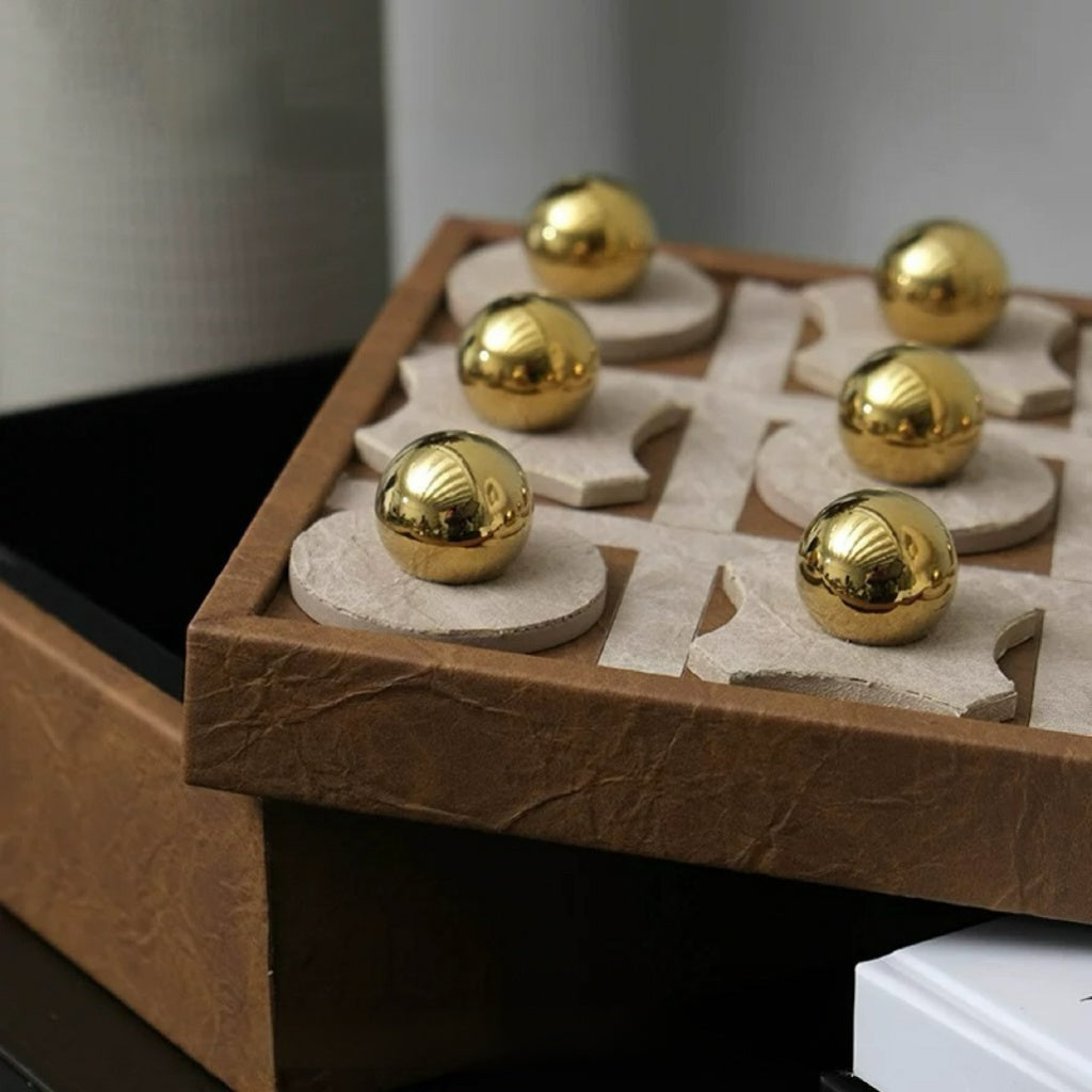 Board game with gold pieces on a wooden board