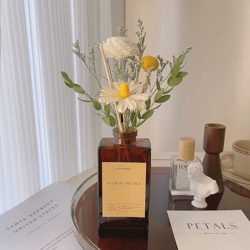 Floral petals bottle with flowers on a table