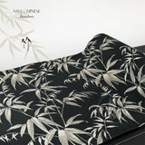 Fabric with silver bamboo leaf pattern on black background, brand 'NWE CHINESE' visible.