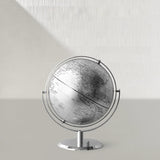 Globe on a stand against a light gray background
