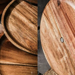 Close-up of wooden trays with a focus on texture and grain.