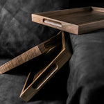Wooden tray on a dark surface