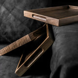 Wooden tray on a dark surface