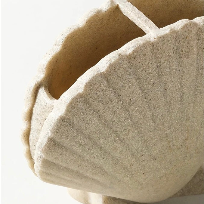 Beige stone bowl on a white background
