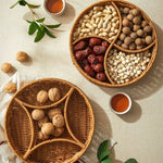 Two woven baskets filled with various nuts and dried fruits on a light surface.