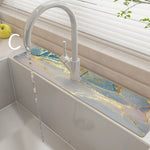 Kitchen sink with marble-like countertop and modern faucet