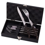 Set of cutlery including knives and forks in a black case on a white background