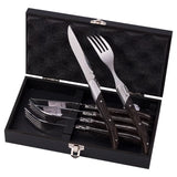 Set of cutlery including knives and forks in a black case on a white background