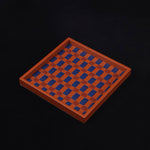 Wooden checkers board with alternating brown and blue squares on a black background