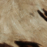 Close-up of textured beige surface with brown accents