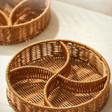 Two woven baskets on a light surface with soft shadows