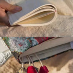 Open notebook with a hand holding it, followed by a close-up of decorative earrings.