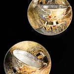 Two gold and silver decorative plates with intricate designs on a black background