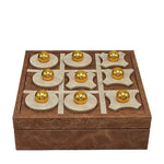 Wooden tic-tac-toe game set with gold pieces on a white background