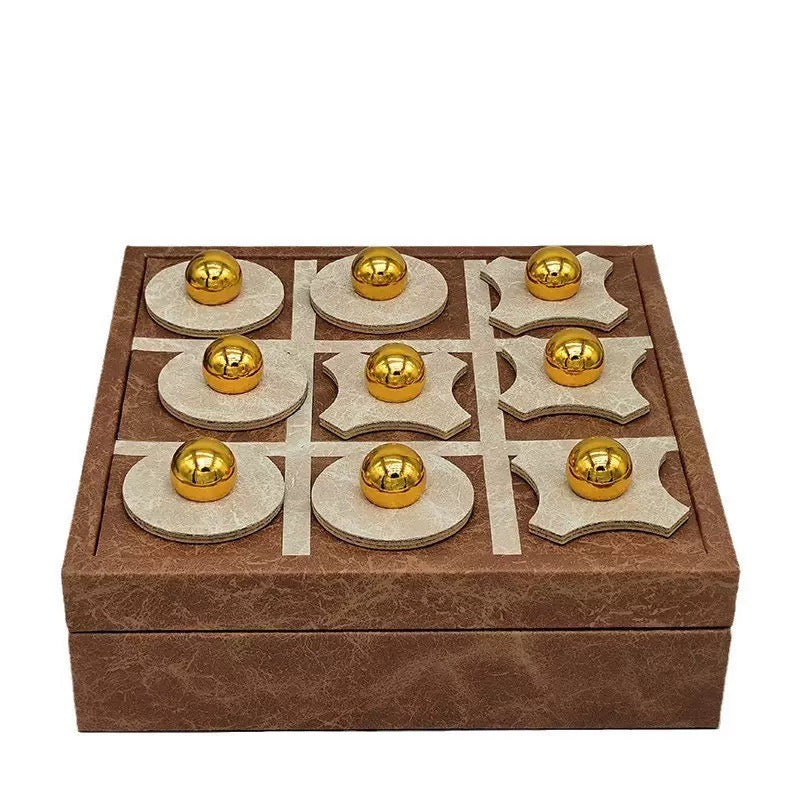 Wooden tic-tac-toe game set with gold pieces on a white background