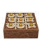 Wooden tic-tac-toe game set with gold pieces on a white background