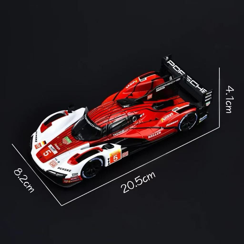 Model racing car with Porsche branding on a clear stand, showing dimensions.