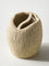 Textured ceramic vase on a white background