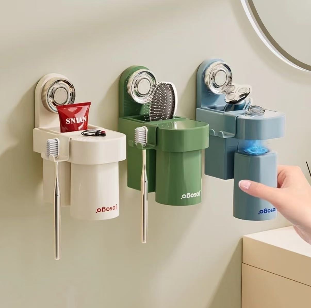 Wall mounted magnetic toothbrush cup set in white, green, and blue with suction holder and storage rack for bathroom organization