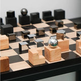 Wooden and metallic chess pieces on a chessboard