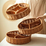 Three woven baskets of different sizes on a light surface with a neutral background