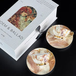 Two decorative coasters with artistic designs on a 'DEM & BALLAD' branded box.